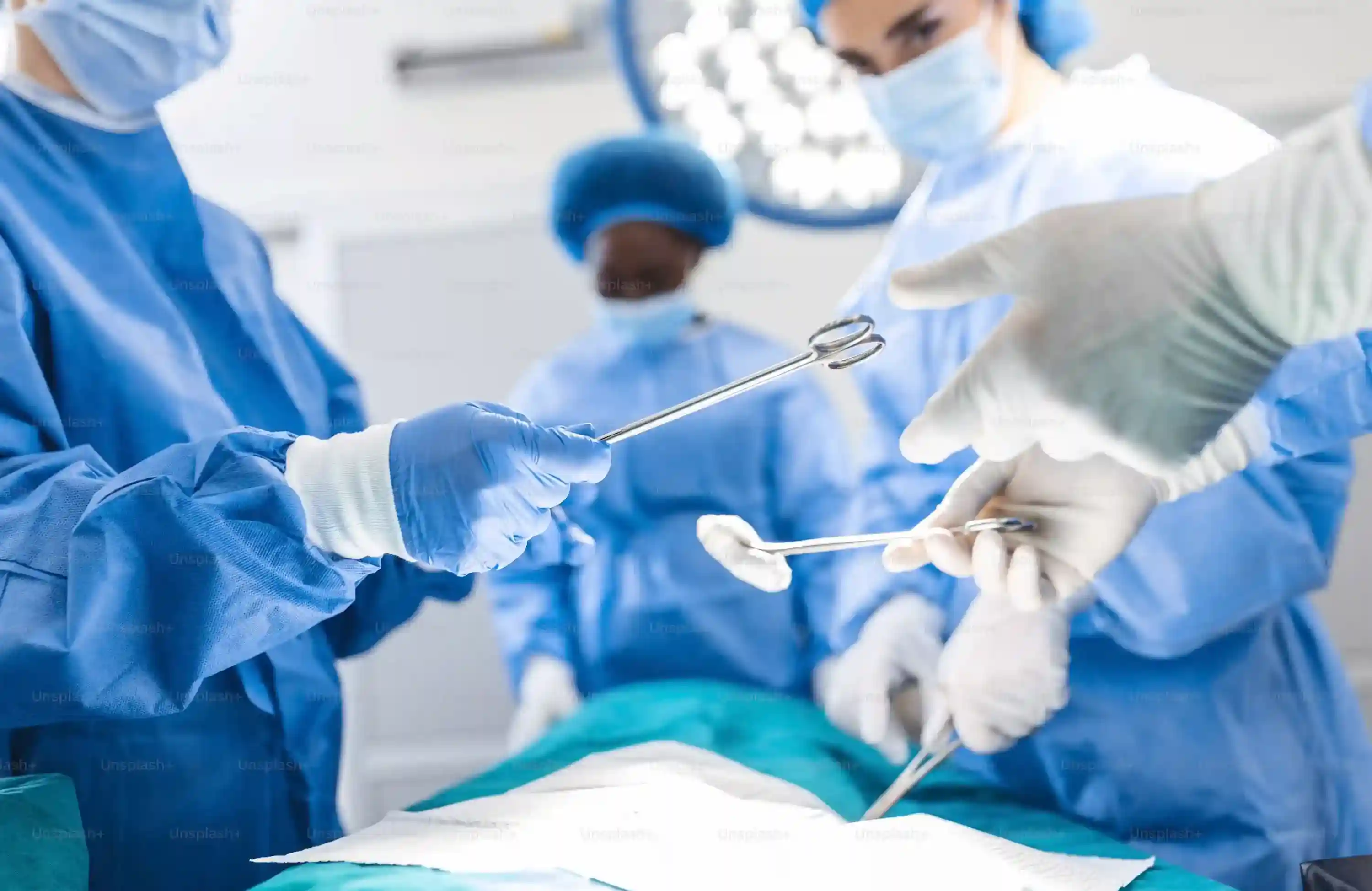 Stock photograph of a surgical team preparing an operating room